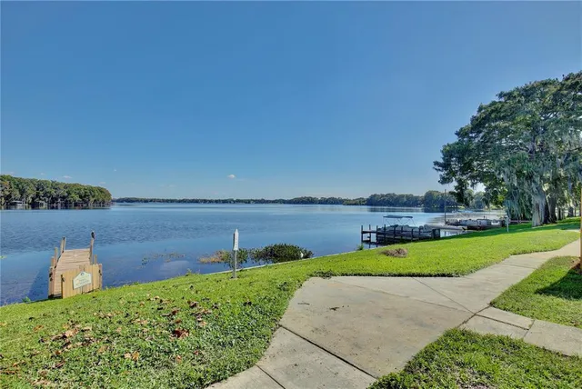 a view of a house with patio and a yard
