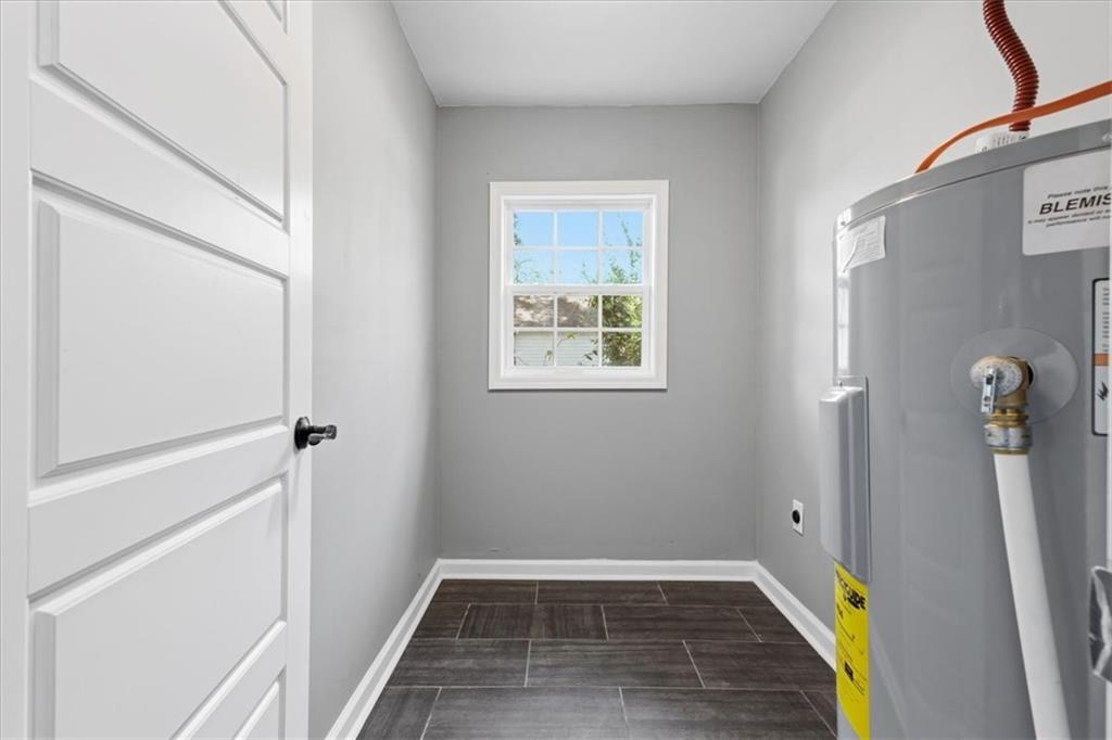 409 Calhoun Avenue Northeast Rome, GA 30161 - Photo 17 of 25 a view of an entryway with wooden floor and a hallway