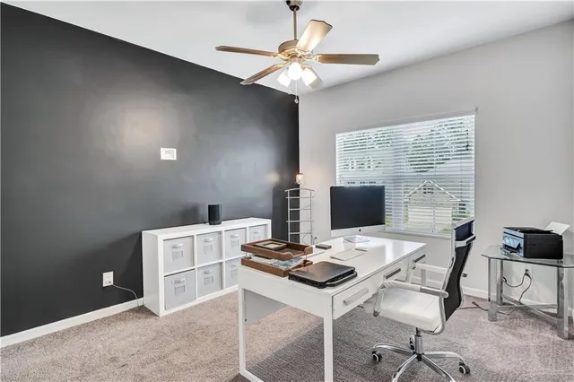 a workspace with furniture and a lamp