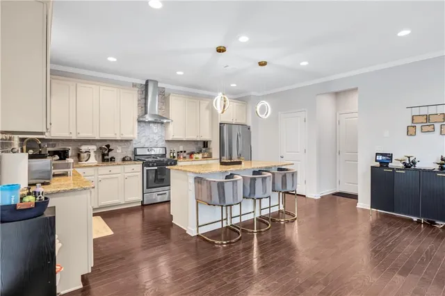 a kitchen with a table and chairs in it