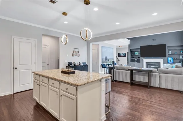 a kitchen with counter top space and stainless steel appliances