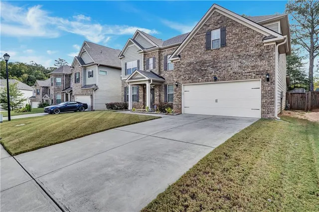 front view of a house with a yard