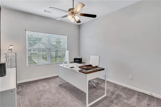 a kitchen with stainless steel appliances kitchen island a white stove top oven and cabinets