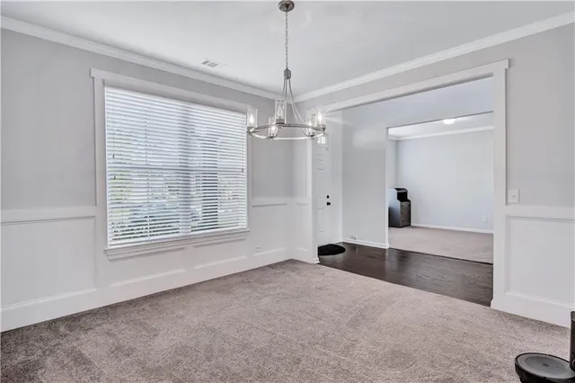 a view of a room with window chandelier and windows