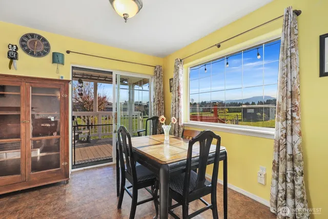 a view of a dining room with furniture window and outside view