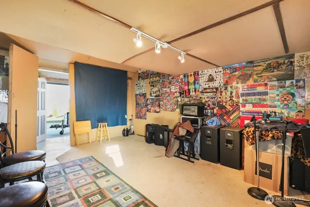 a view of a terrace with lawn chairs