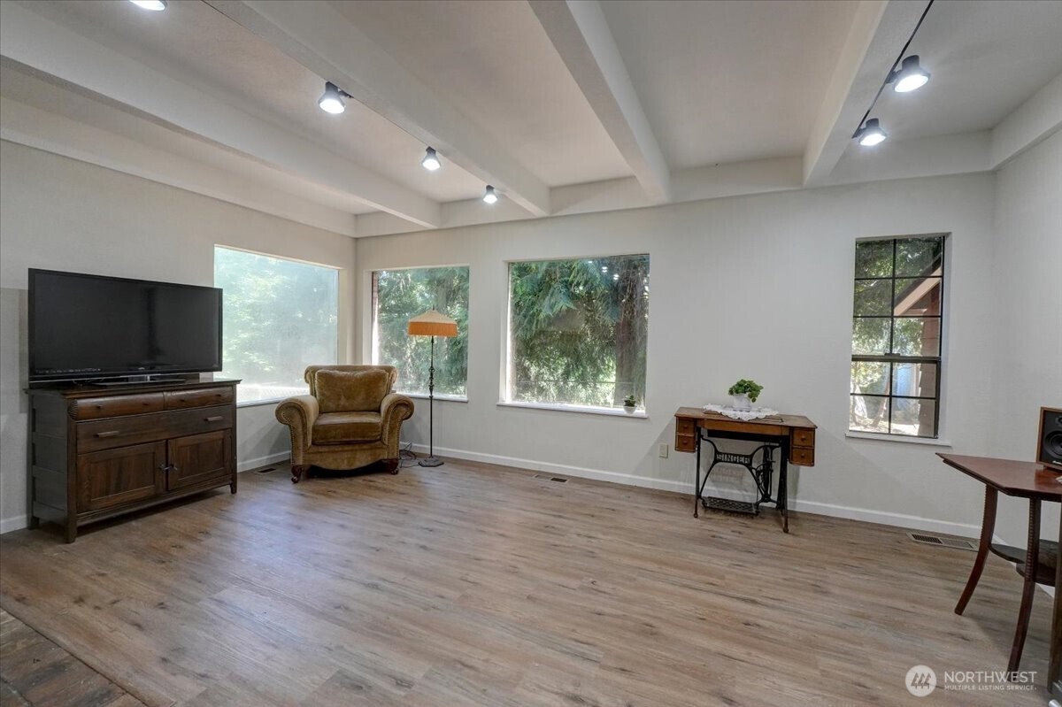 680 Southeast Prospect Street Chehalis, WA 98532 - Photo 12 of 39 a living room with furniture and a flat screen tv