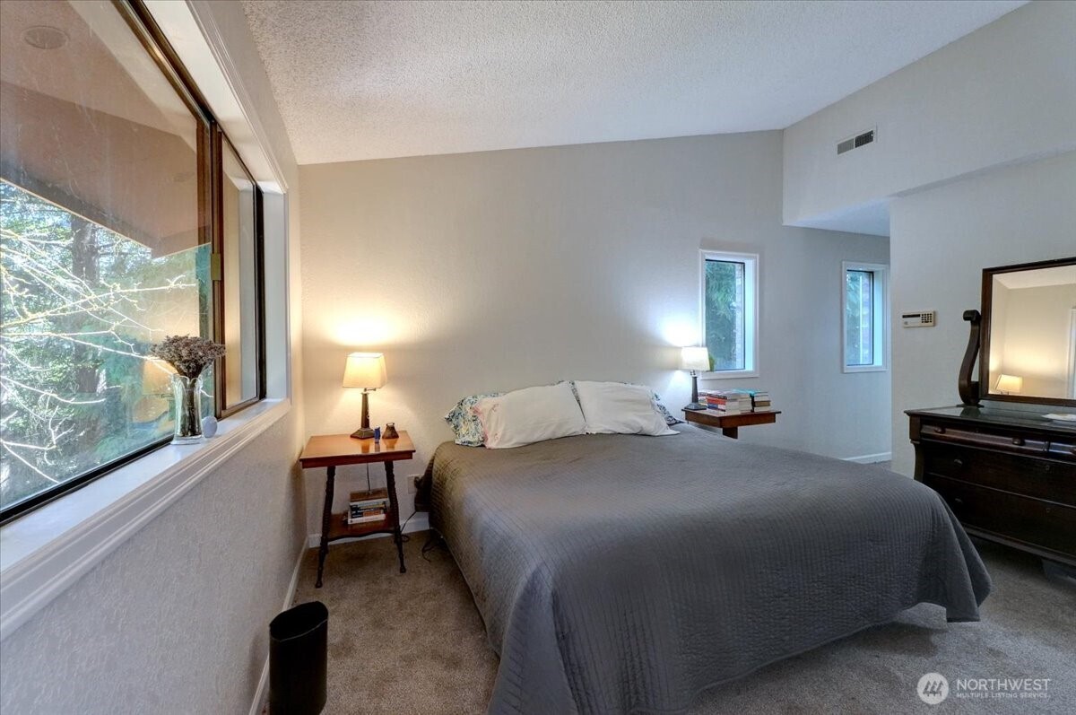 680 Southeast Prospect Street Chehalis, WA 98532 - Photo 23 of 39 a bedroom with a bed and a large window