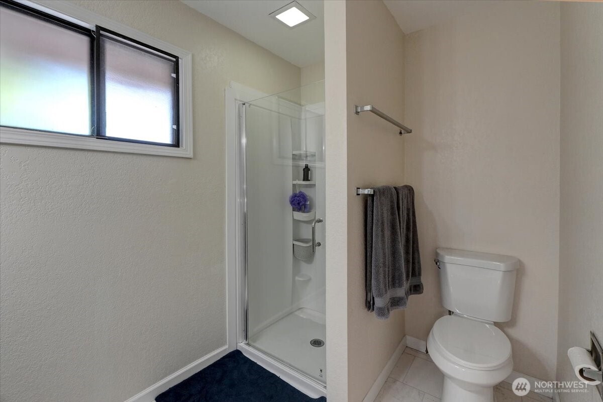 680 Southeast Prospect Street Chehalis, WA 98532 - Photo 24 of 39 a white toilet sitting next to a bathroom sink