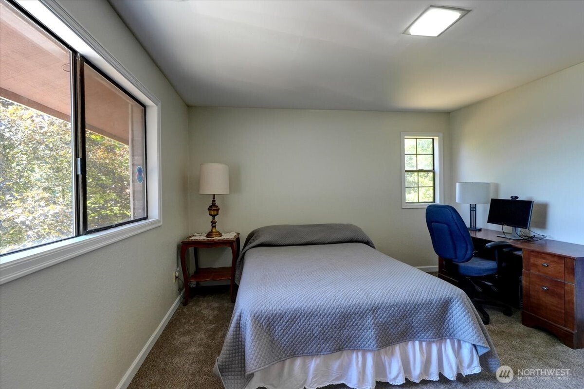 680 Southeast Prospect Street Chehalis, WA 98532 - Photo 33 of 39 a bedroom with a bed and a window