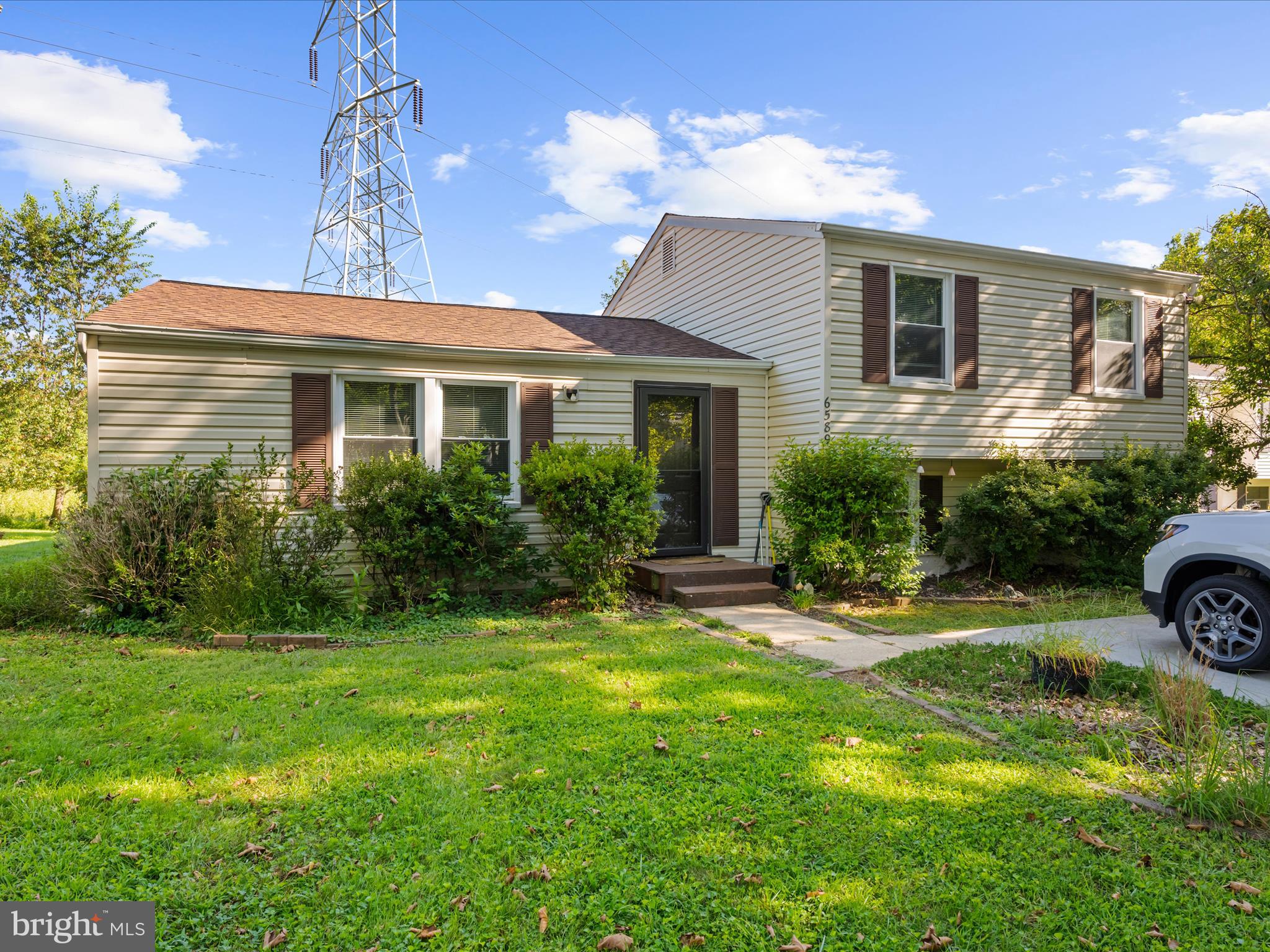 a front view of a house with garden and porch