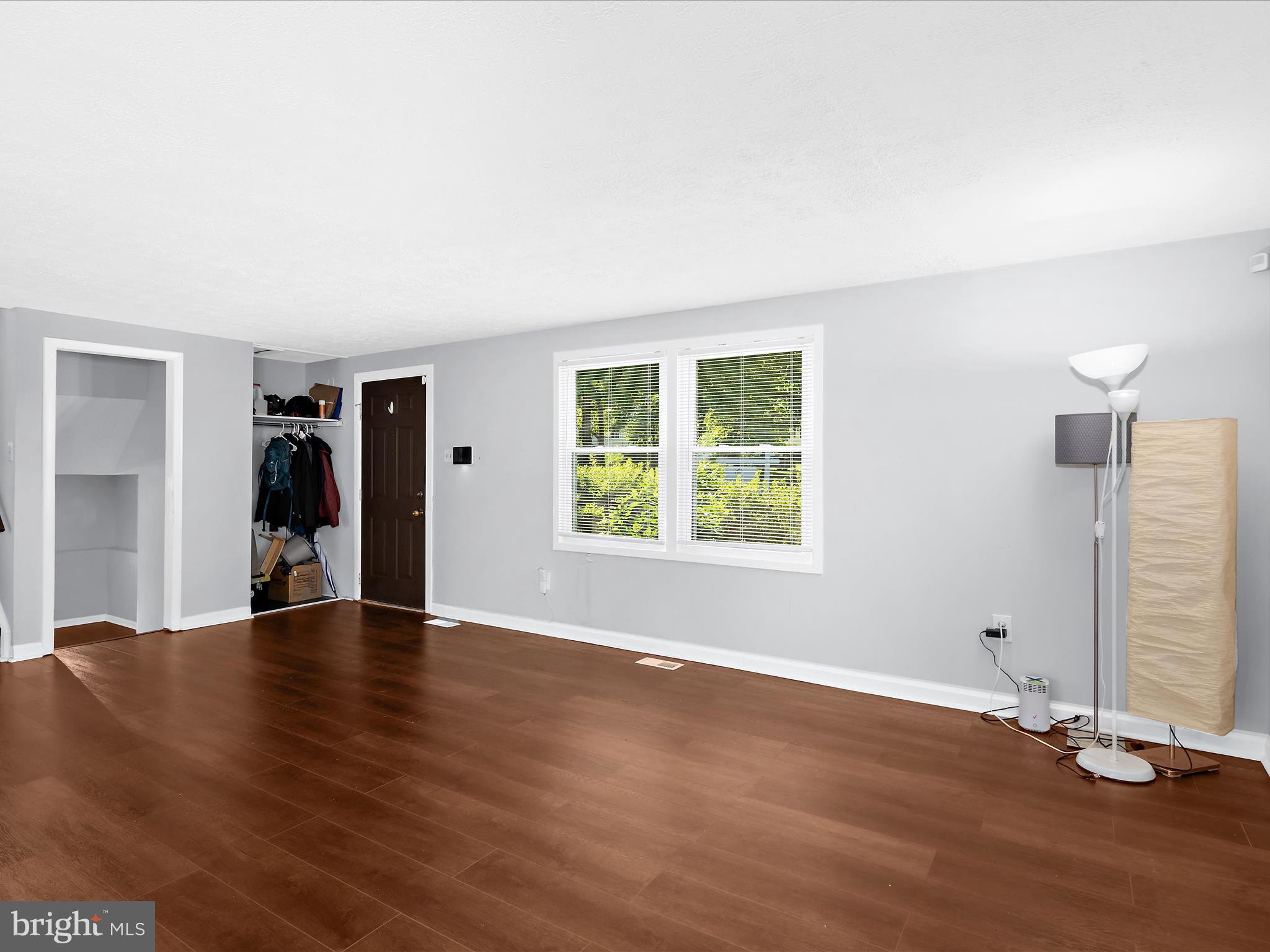 6589 Robin Song Columbia, MD 21045 - Photo 14 of 31 an empty room with wooden floor and closet