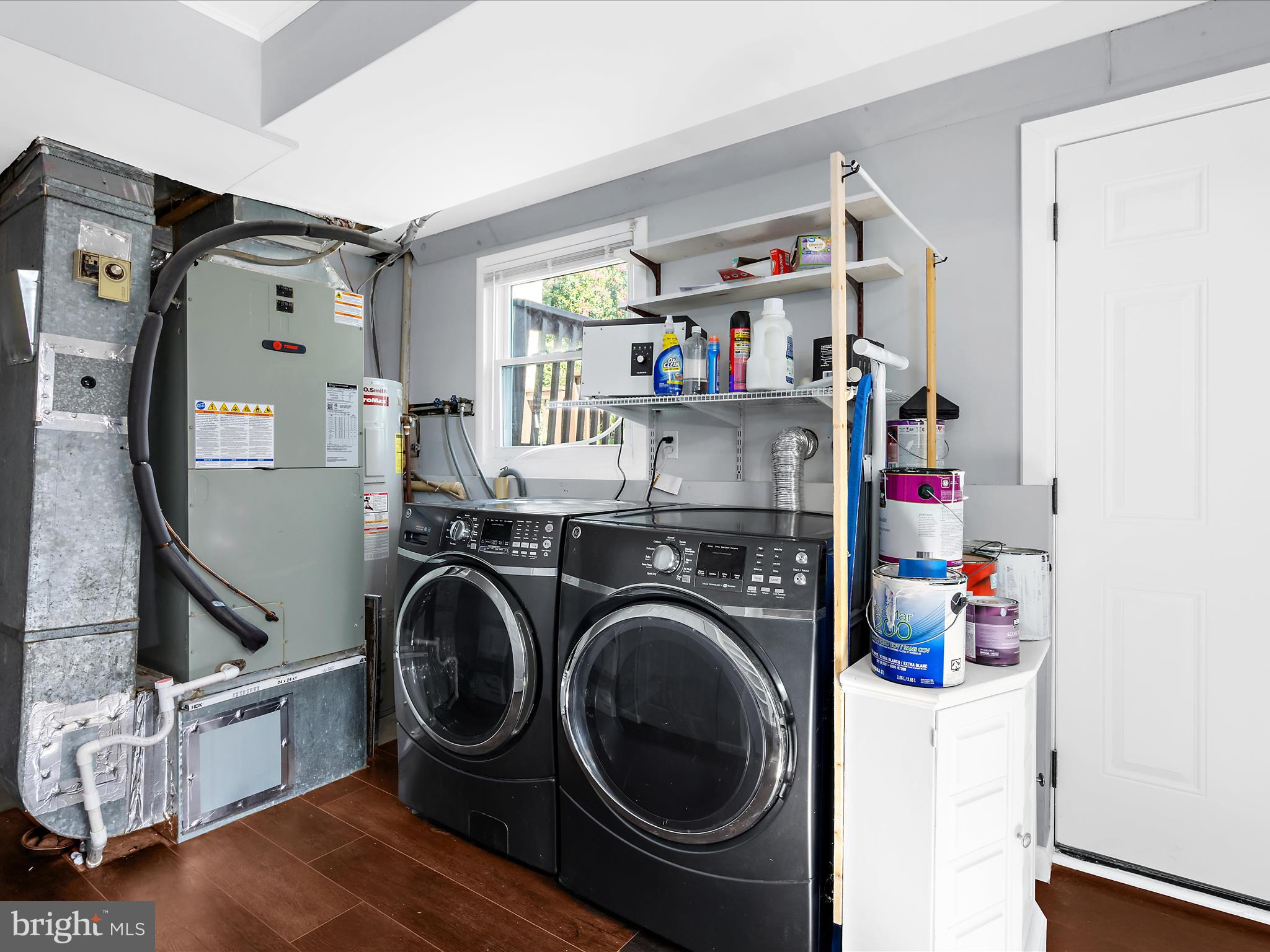 6589 Robin Song Columbia, MD 21045 - Photo 17 of 31 a storage room with washer and dryer