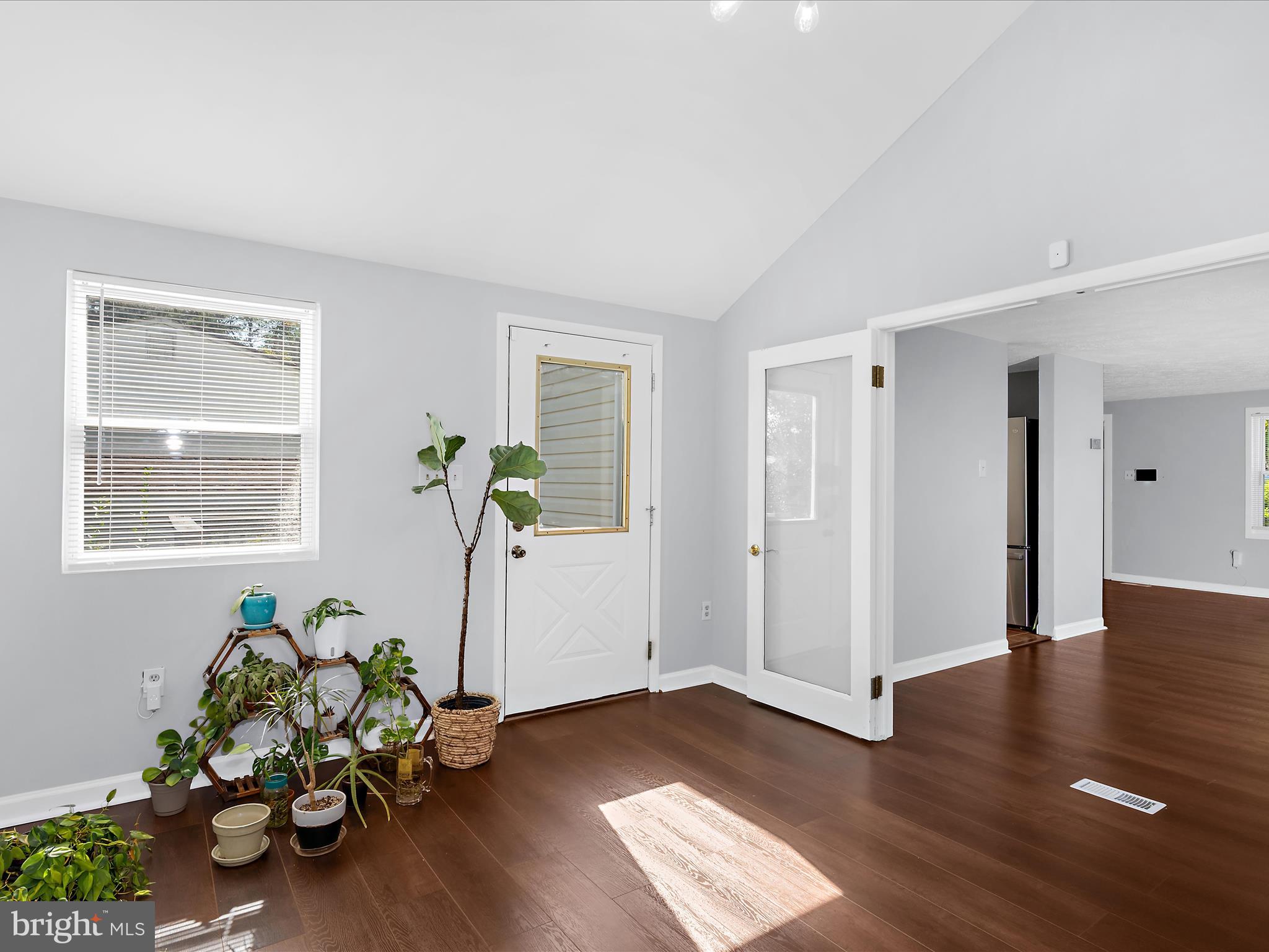 6589 Robin Song Columbia, MD 21045 - Photo 24 of 31 a view of a entryway of wooden floor and a window