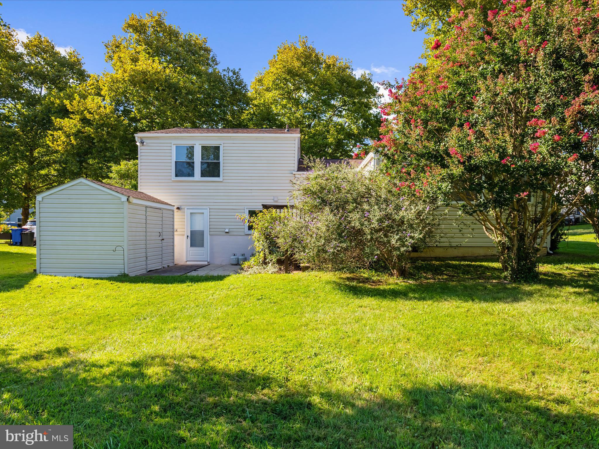 6589 Robin Song Columbia, MD 21045 - Photo 28 of 31 a view of a house with swimming pool and a yard