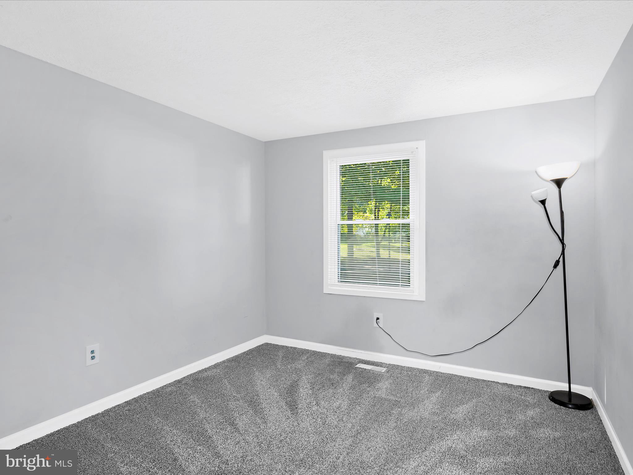 6589 Robin Song Columbia, MD 21045 - Photo 10 of 31 a view of an empty room with a window