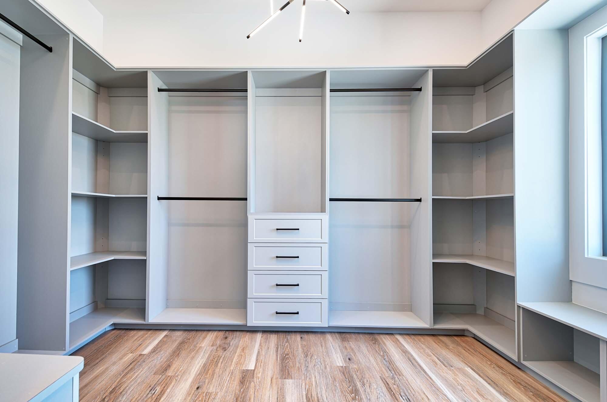 143 Trinidad Street Naples, FL 34113 - Photo 34 of 62 a view of walk in closet with empty racks
