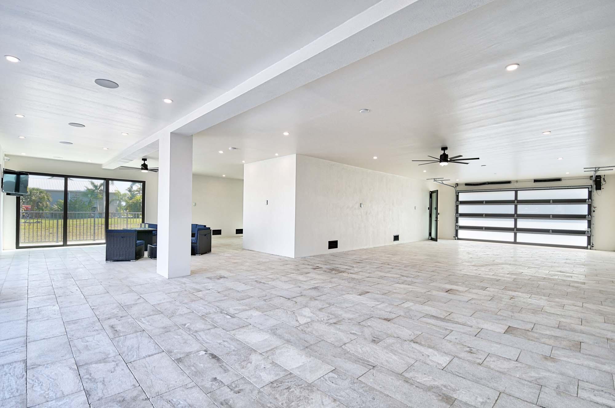 143 Trinidad Street Naples, FL 34113 - Photo 43 of 62 a view of an empty room with a window