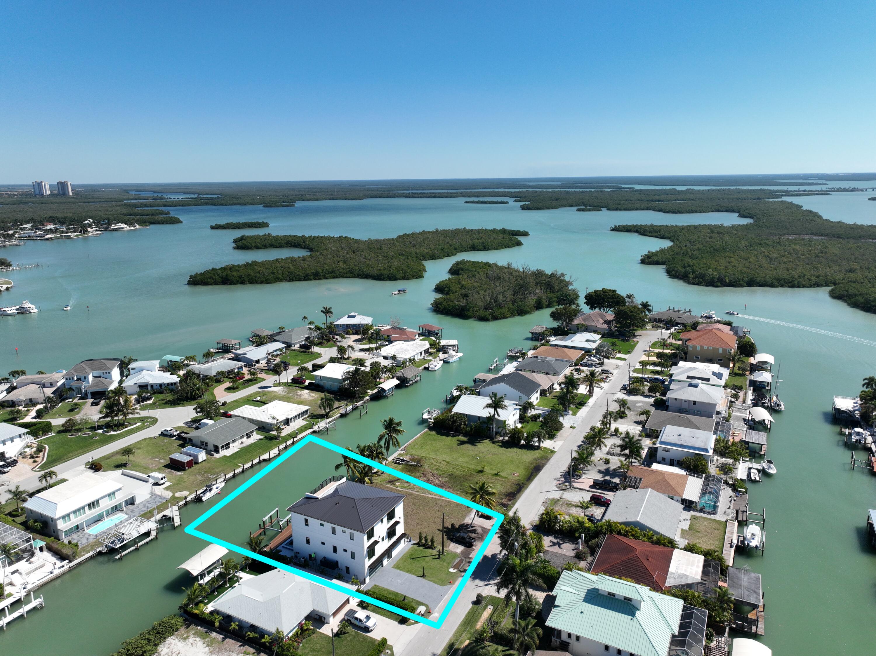 143 Trinidad Street Naples, FL 34113 - Photo 52 of 62 an aerial view of a city
