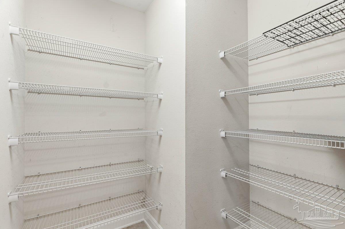 5468 Madelines Way Pace, FL 32571 - Photo 17 of 46 a view of walk in closet