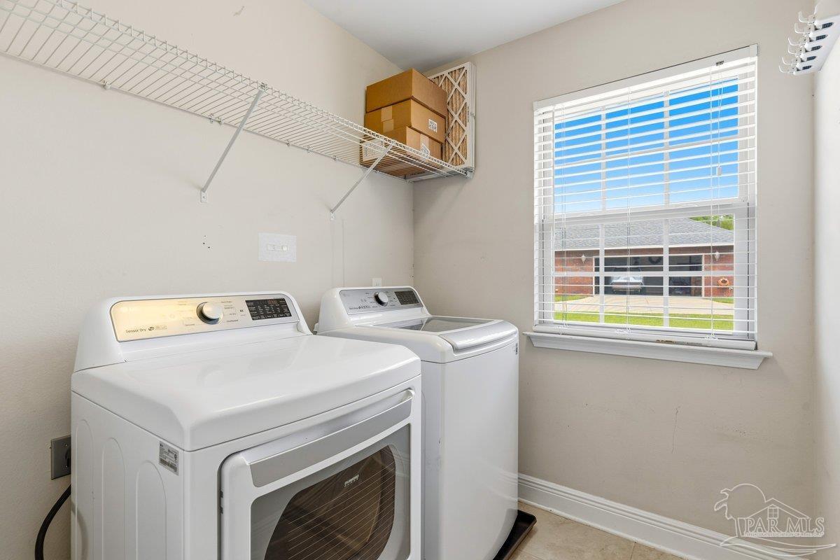 5468 Madelines Way Pace, FL 32571 - Photo 18 of 46 a utility room with dryer and washer