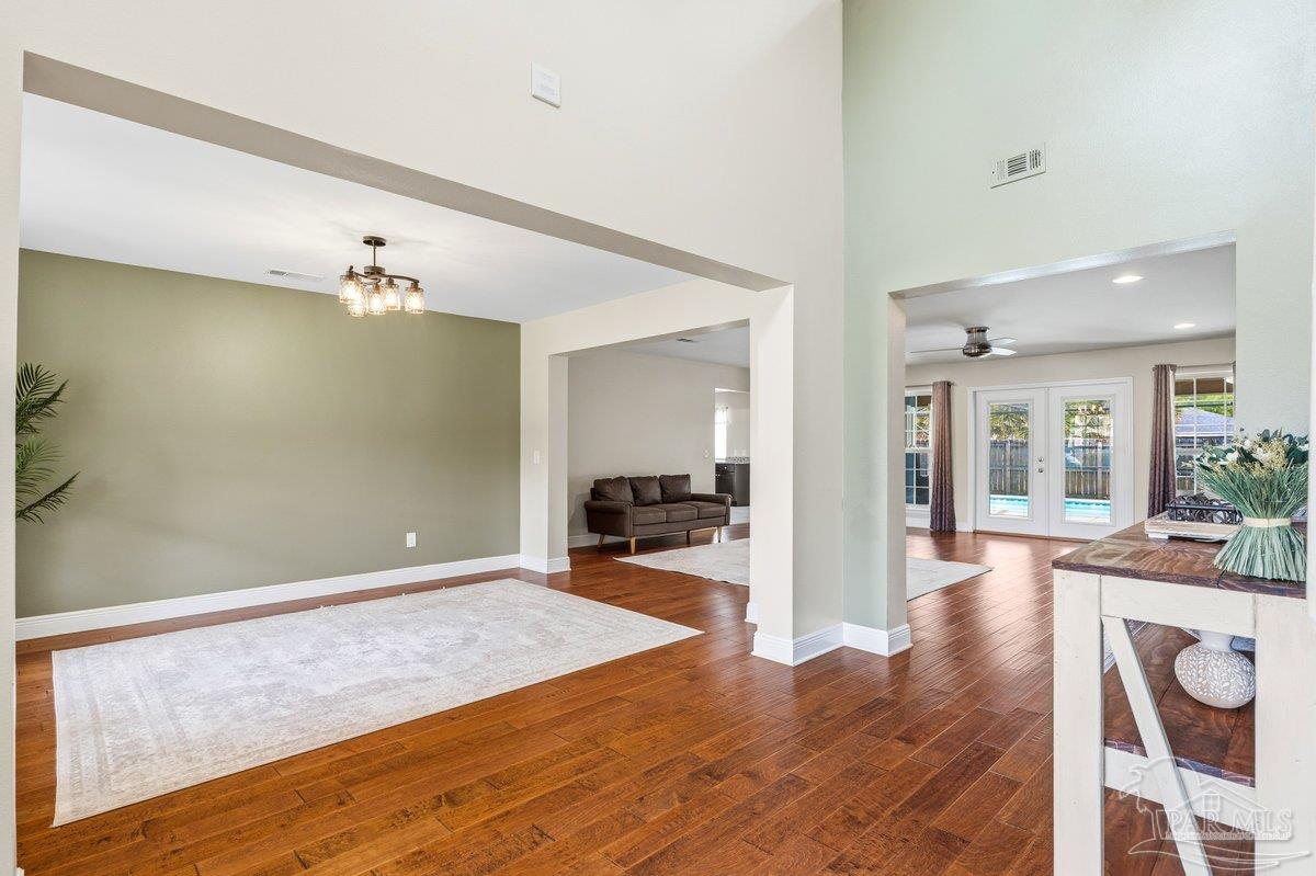 5468 Madelines Way Pace, FL 32571 - Photo 21 of 46 a view of a livingroom with wooden floor