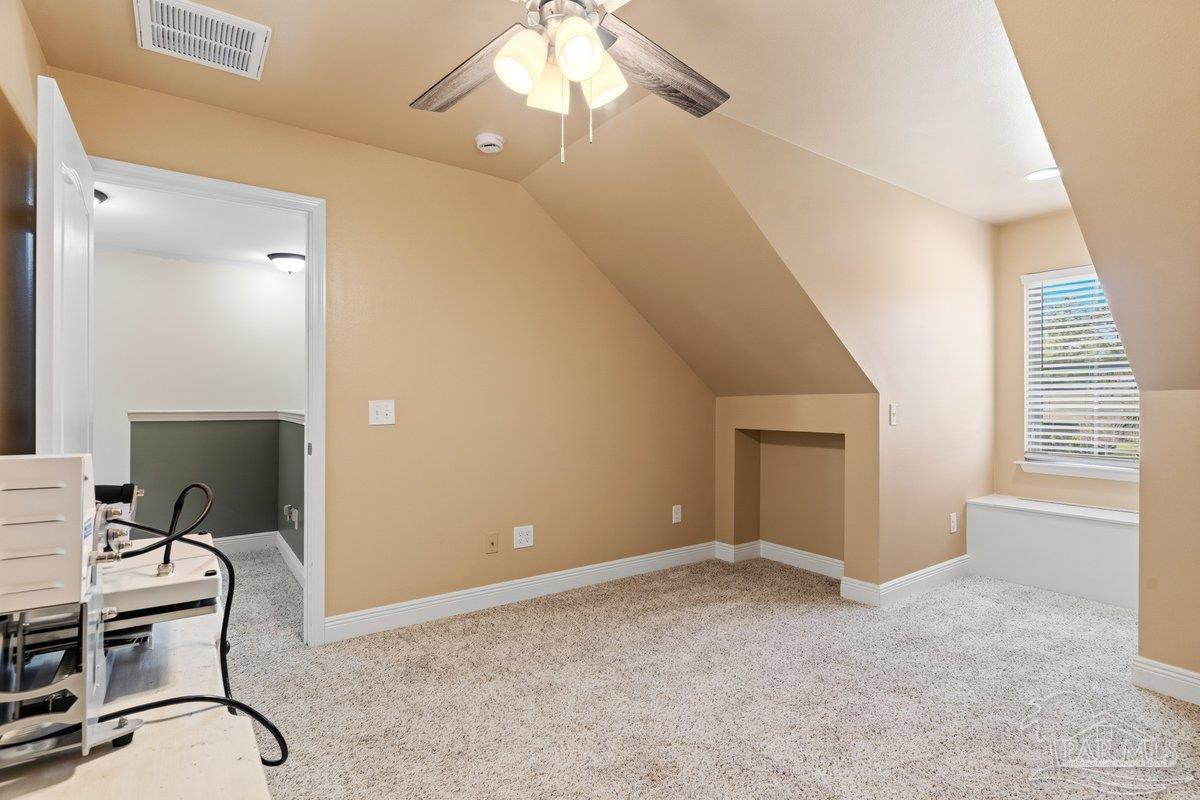 5468 Madelines Way Pace, FL 32571 - Photo 26 of 46 a view of a workspace with furniture and a window