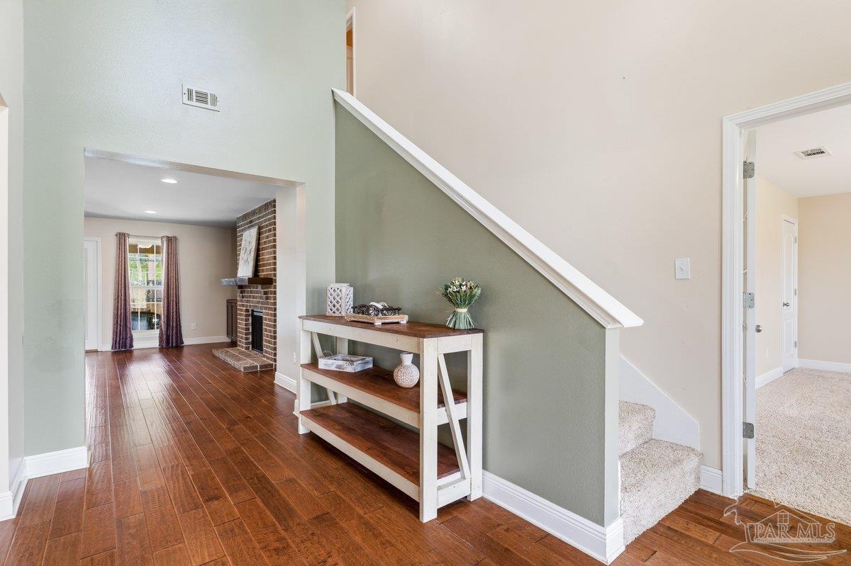 5468 Madelines Way Pace, FL 32571 - Photo 3 of 46 a view of livingroom with furniture and wooden floor
