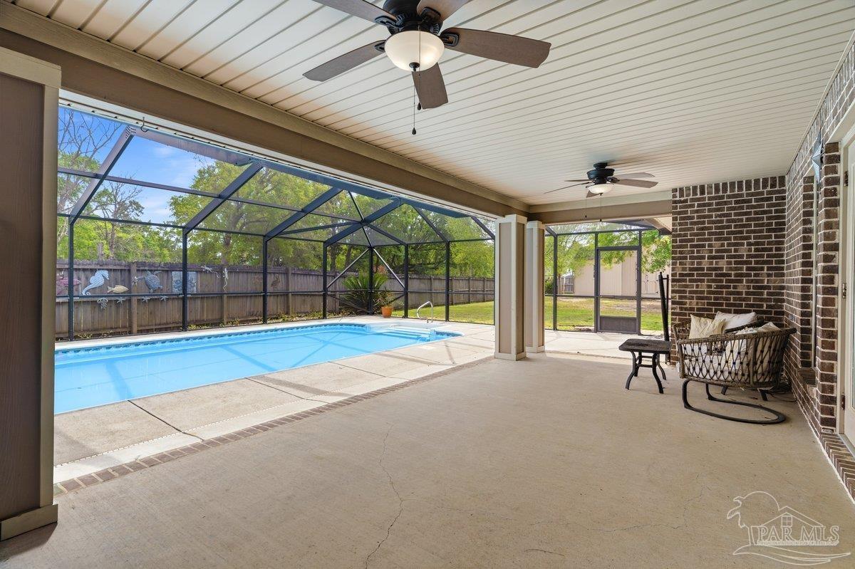 5468 Madelines Way Pace, FL 32571 - Photo 36 of 46 a living room with furniture and windows