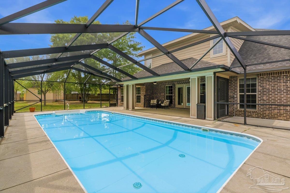 5468 Madelines Way Pace, FL 32571 - Photo 40 of 46 a view of indoor pool and sitting area