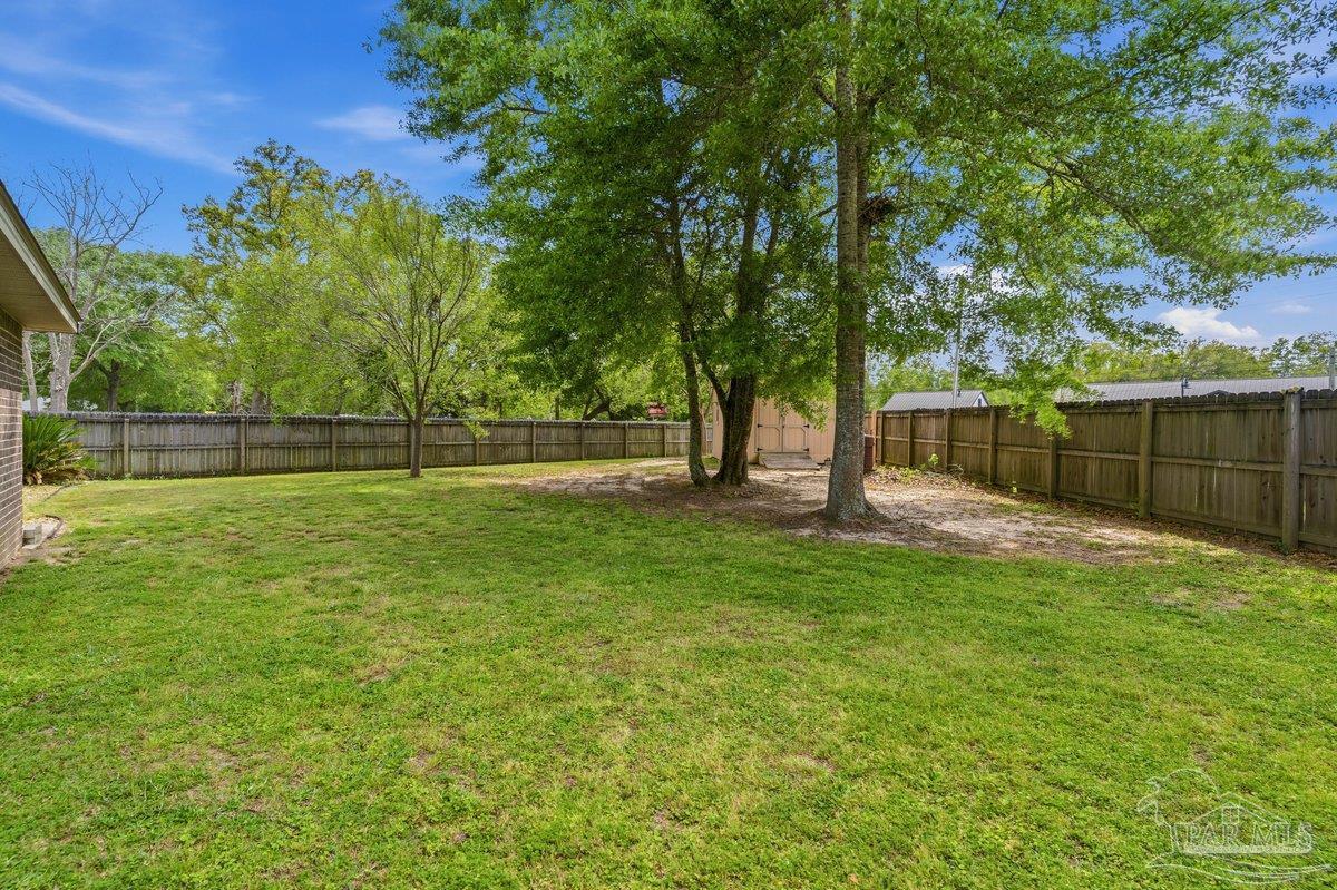5468 Madelines Way Pace, FL 32571 - Photo 45 of 46 a view of outdoor space with deck and yard