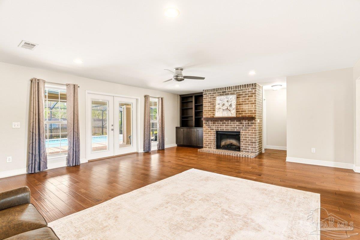5468 Madelines Way Pace, FL 32571 - Photo 5 of 46 a view of a livingroom with a fireplace