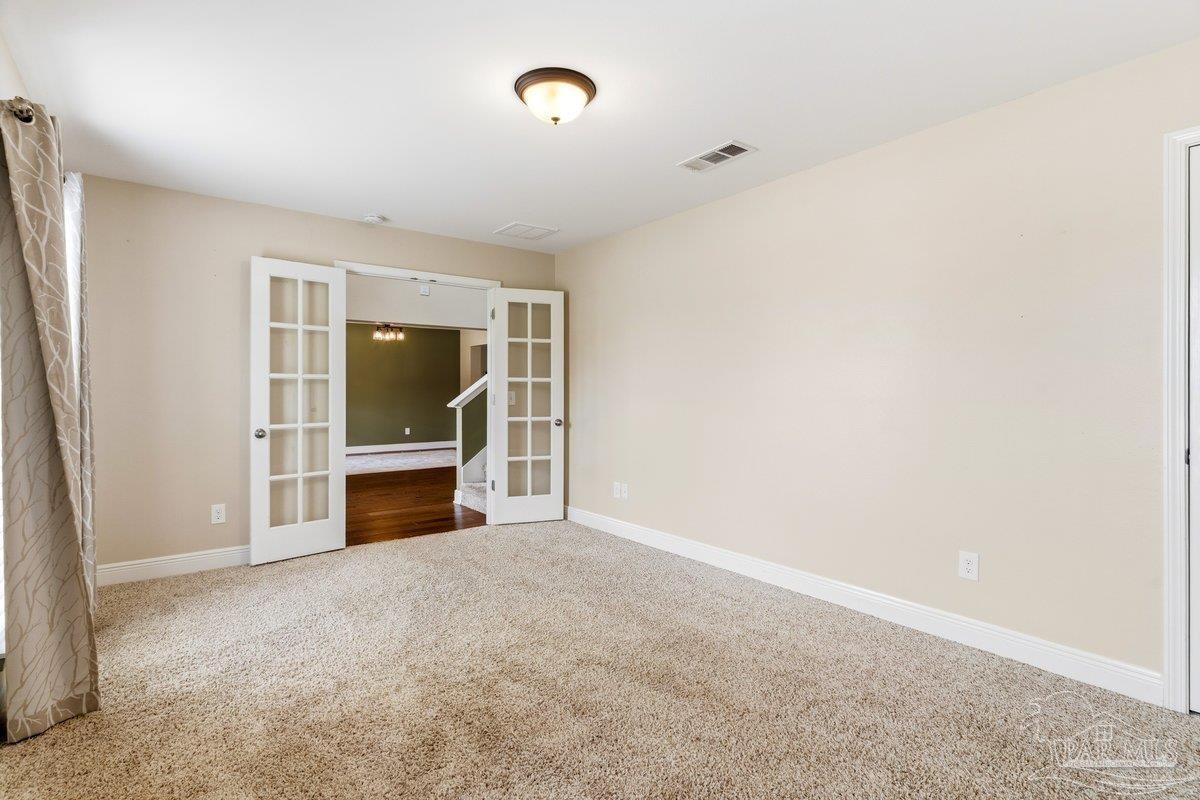 5468 Madelines Way Pace, FL 32571 - Photo 8 of 46 a view of an empty room with kitchen