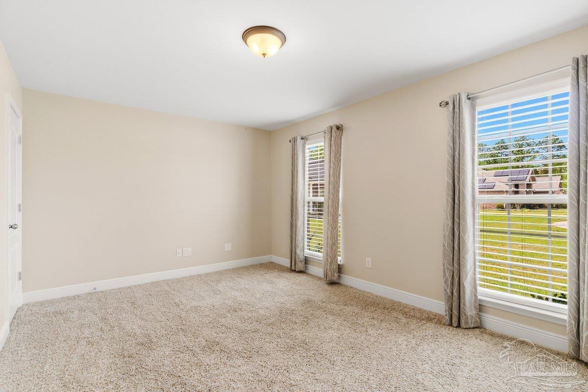 5468 Madelines Way Pace, FL 32571 - Photo 9 of 46 an empty room with windows
