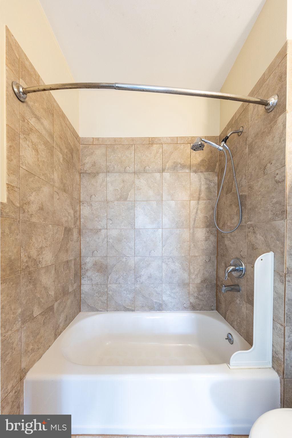 1388 Northeast E Street Northeast Washington, DC 20002 - Photo 12 of 28 a bathroom with a shower and a toilet