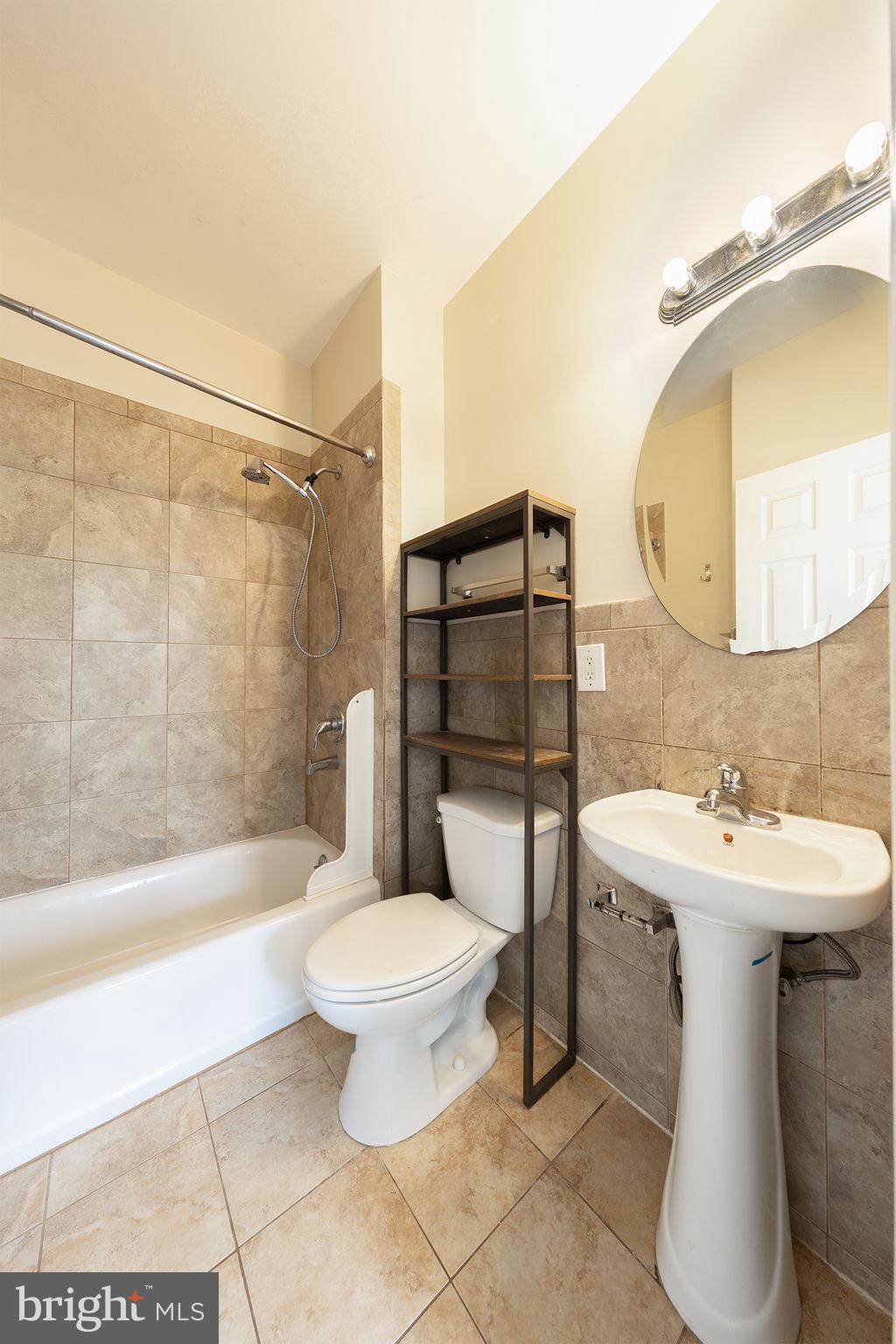 1388 Northeast E Street Northeast Washington, DC 20002 - Photo 13 of 28 a bathroom with a sink toilet and shower