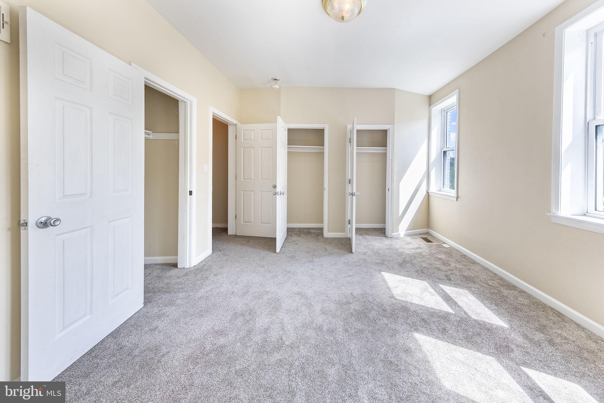 1388 Northeast E Street Northeast Washington, DC 20002 - Photo 14 of 28 an empty room with windows and closet