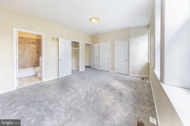 an empty room with windows and window