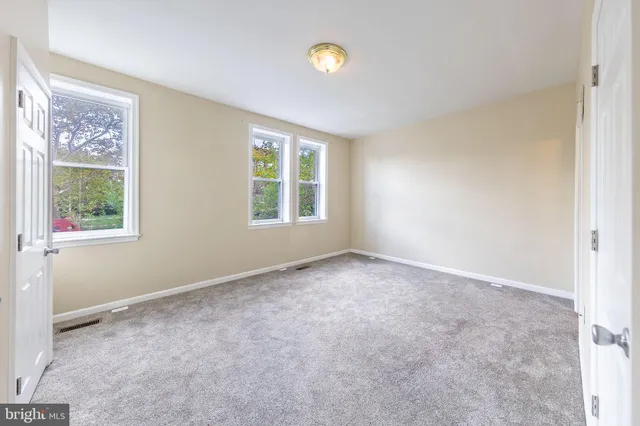 a bathroom with a granite countertop bathtub shower sink and toilet