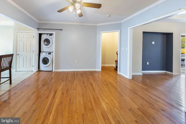 a kitchen with stainless steel appliances granite countertop a stove refrigerator and cabinets