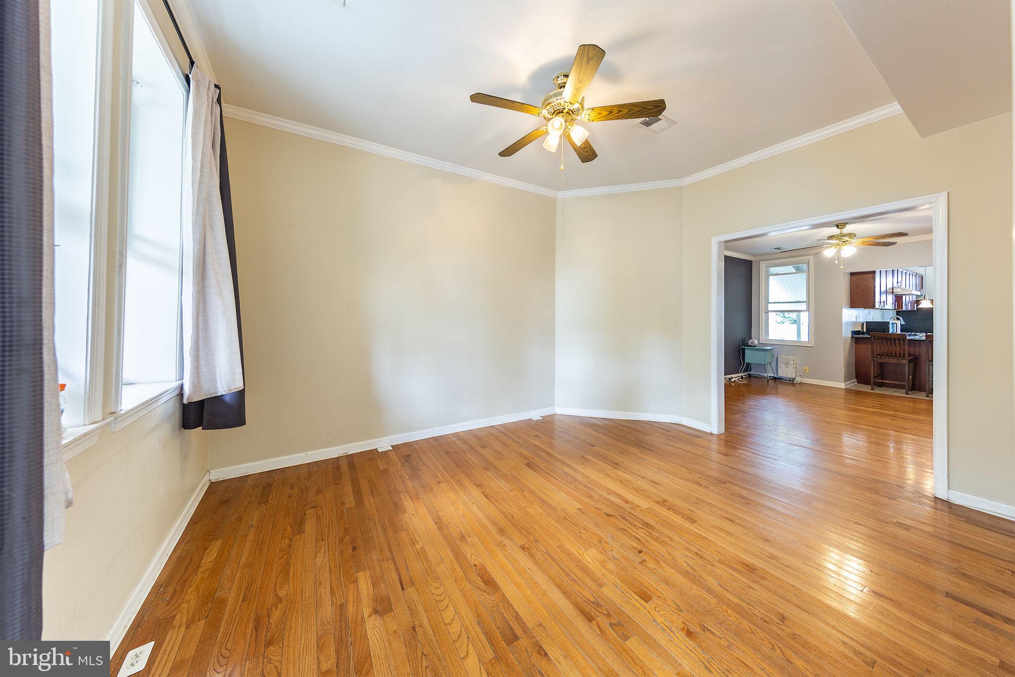 1388 Northeast E Street Northeast Washington, DC 20002 - Photo 24 of 28 a view of empty room with wooden floor and fan