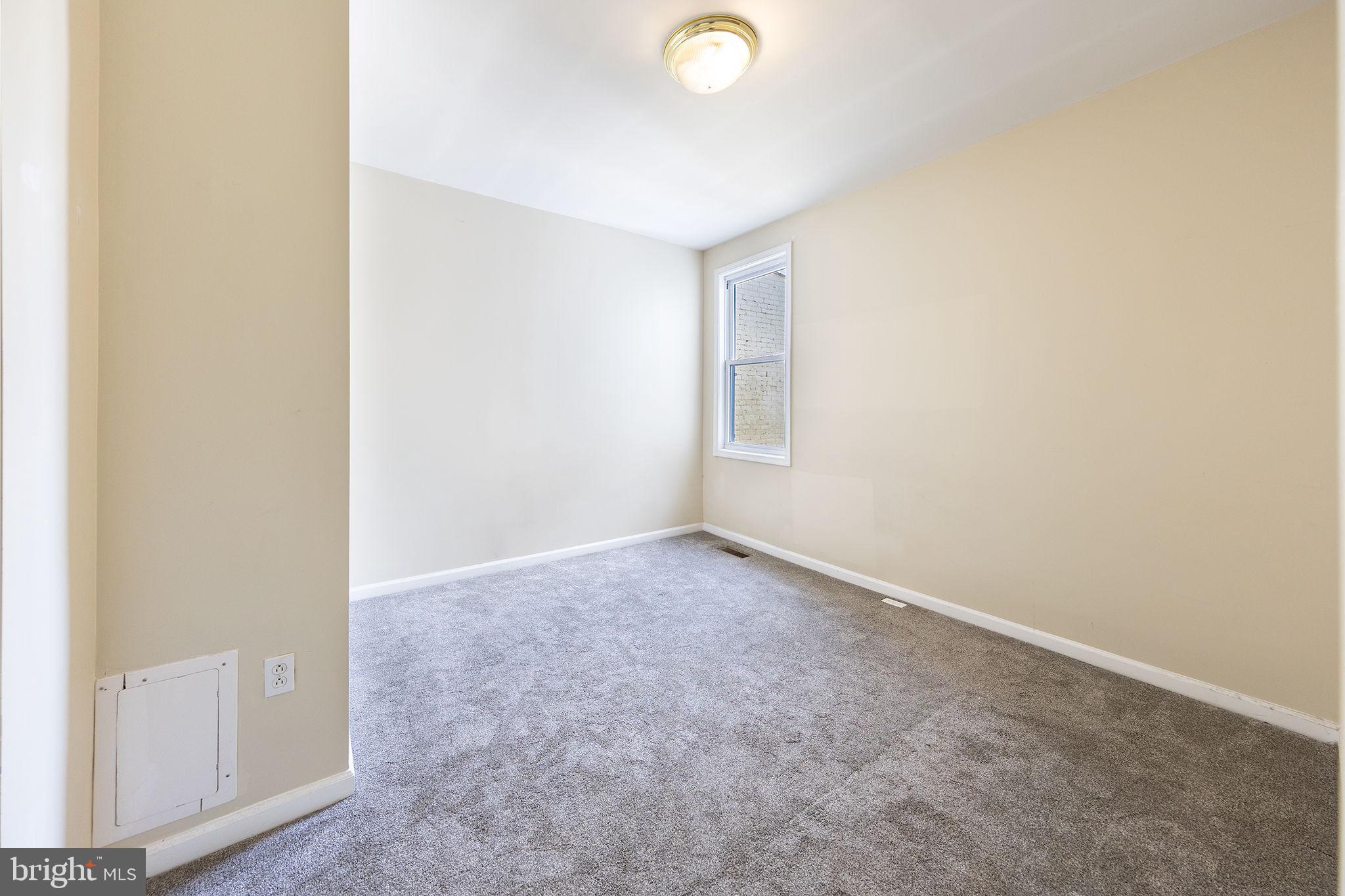 1388 Northeast E Street Northeast Washington, DC 20002 - Photo 10 of 28 an empty room with windows and closet