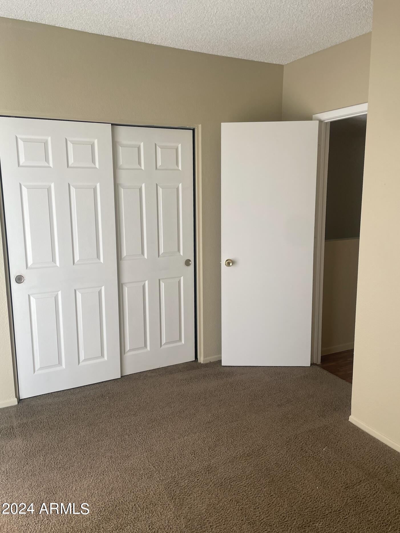 2846 East Kathleen Road, Unit 103 Phoenix, AZ 85032 - Photo 12 of 17 a view of an empty room