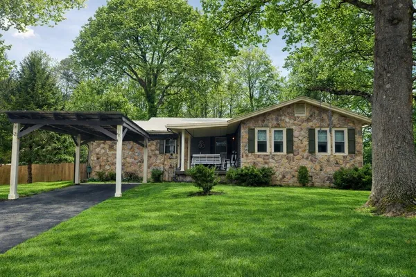 a front view of a house with garden