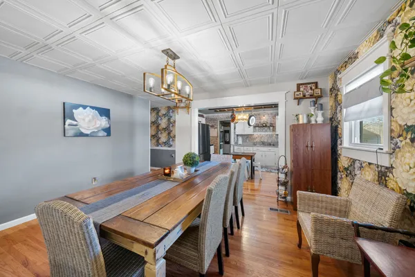 a dining room with furniture and window