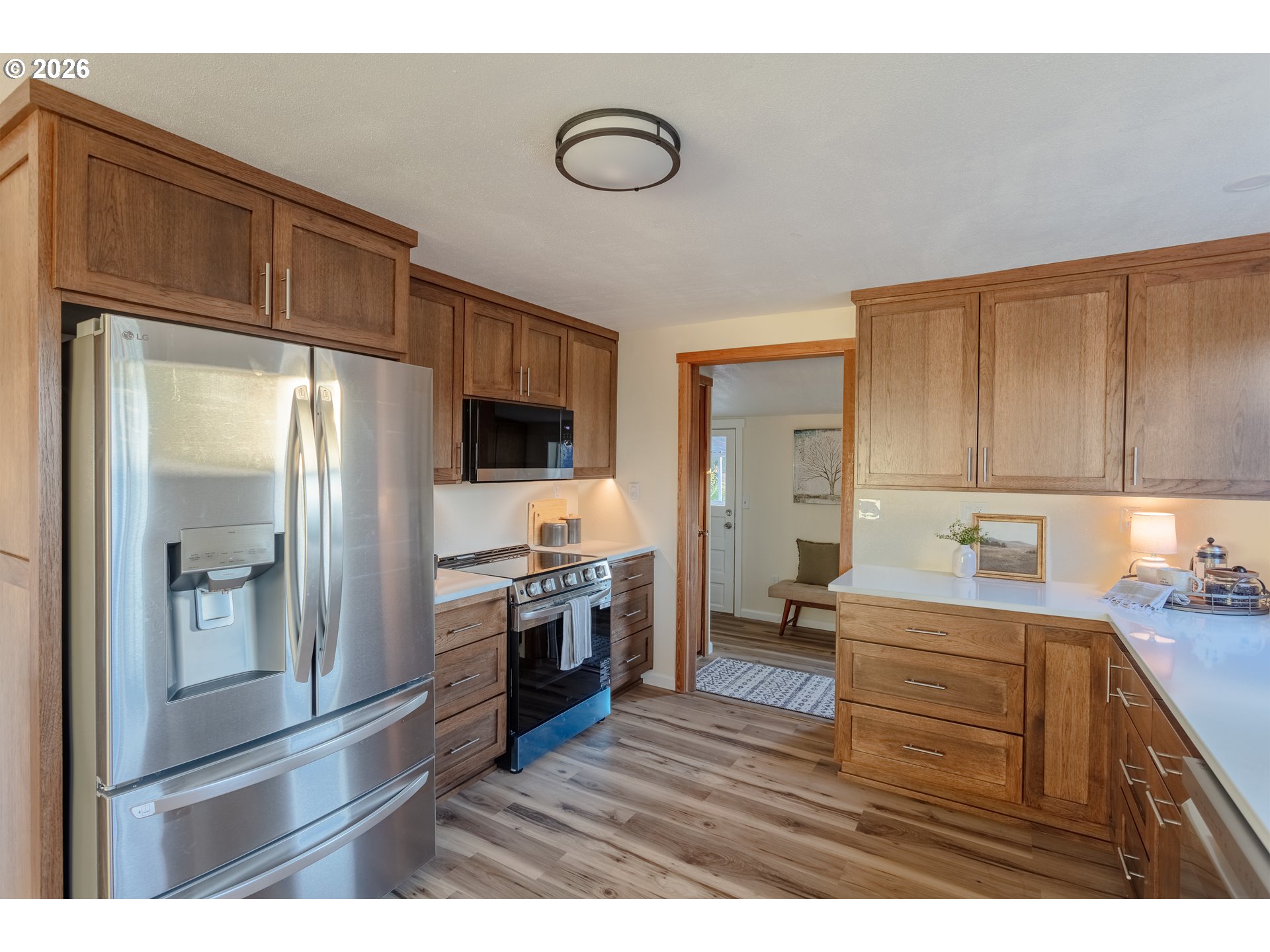 5423 Mt Vernon Road Springfield, OR 97478 - Photo 11 of 35 a kitchen with kitchen island granite countertop a sink cabinets and stainless steel appliances