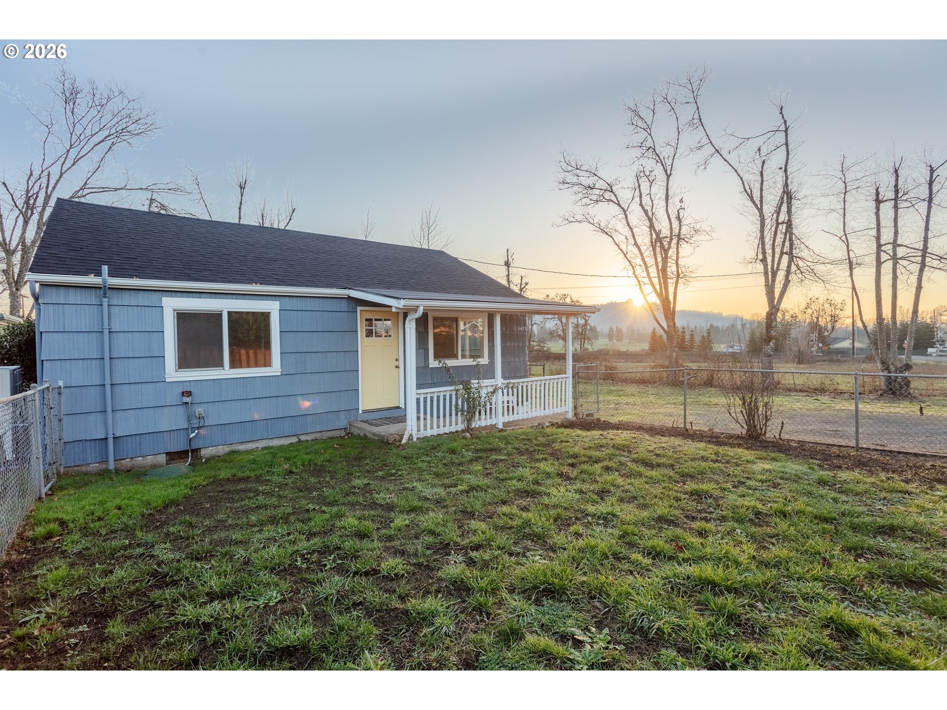 5423 Mt Vernon Road Springfield, OR 97478 - Photo 2 of 35 a view of a yard in front of a house with a large tree