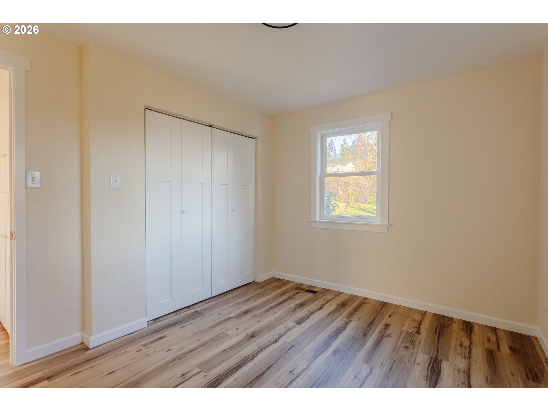 5423 Mt Vernon Road Springfield, OR 97478 - Photo 24 of 35 a view of an empty room with wooden floor and a window