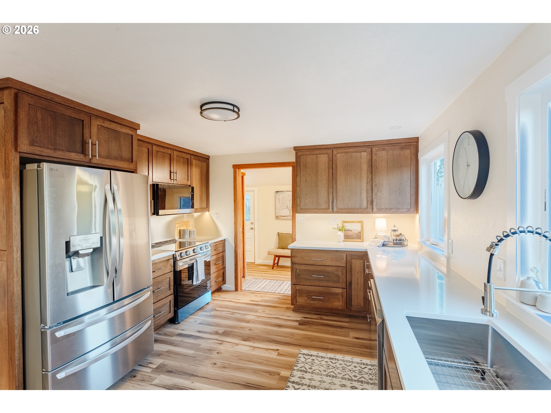 5423 Mt Vernon Road Springfield, OR 97478 - Photo 8 of 35 a kitchen with stainless steel appliances granite countertop a refrigerator a stove and a sink with large countertops