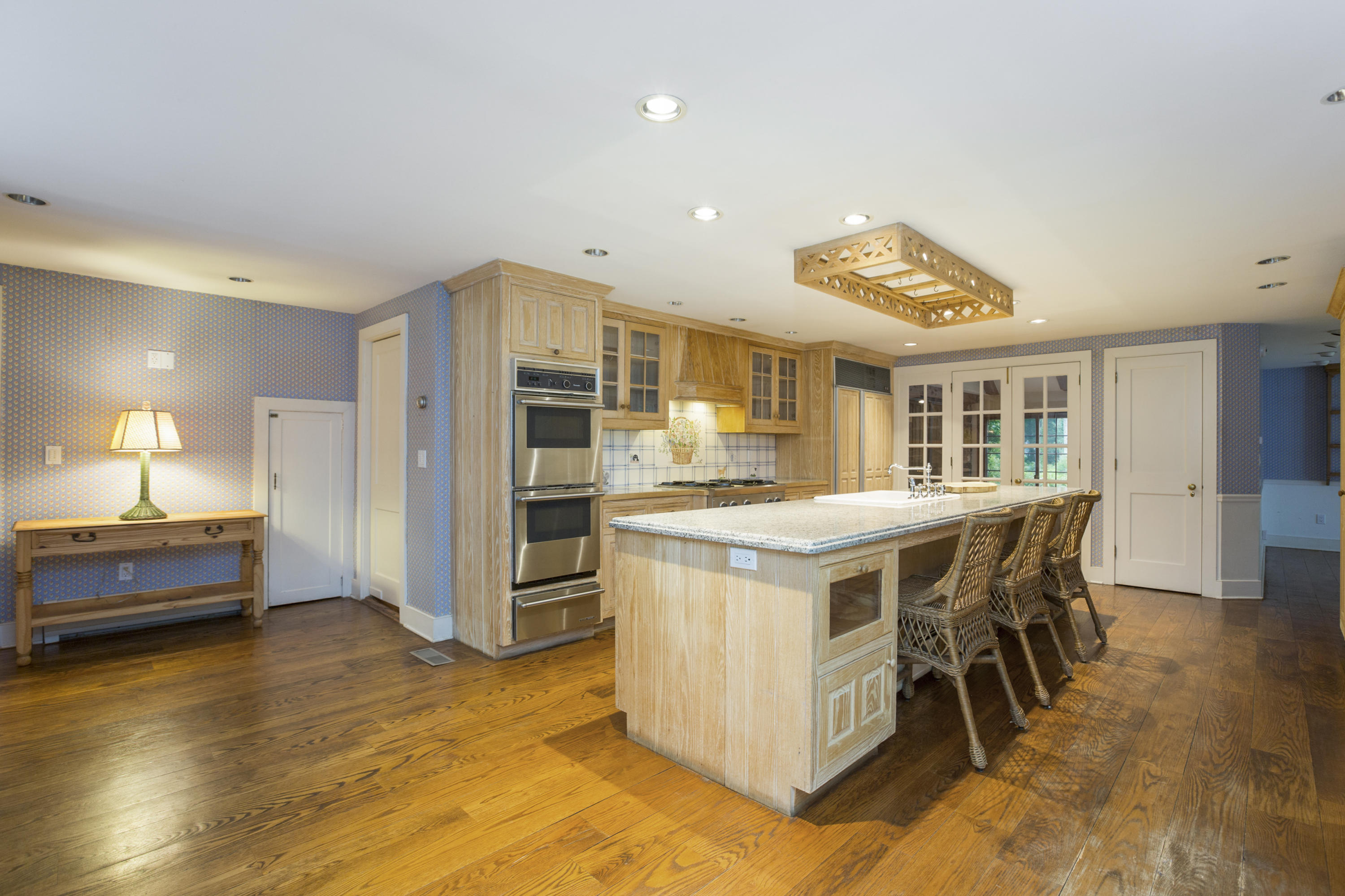 283 Hollow Tree Ridge Road Darien, CT 06820 - Photo 11 of 49 a kitchen with stainless steel appliances granite countertop a stove and a refrigerator